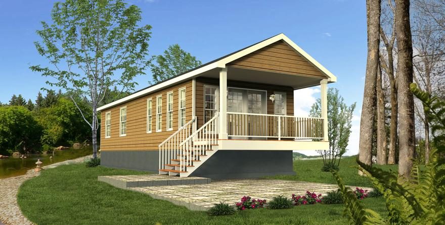 Le chalet La Buse : revêtement de bois clair, longue galerie couverte, sous les conifères